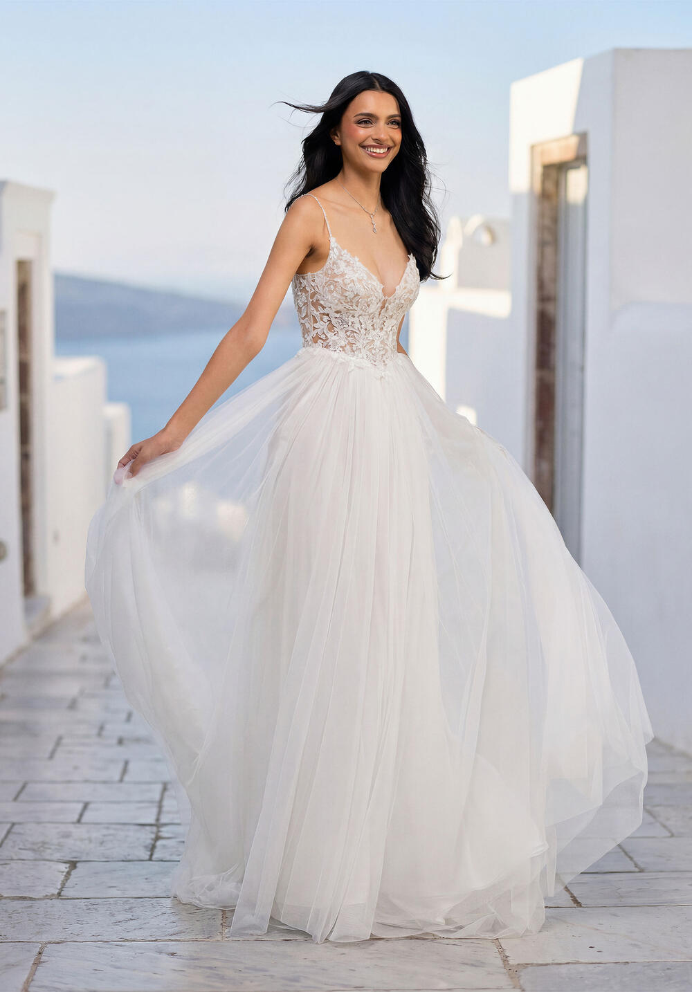 Morilee tulle gown with a lace bodice and thin straps, skirt in motion